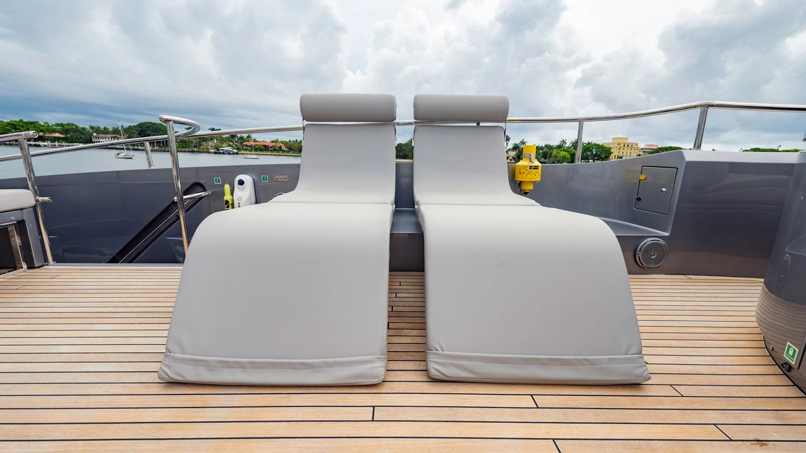 The sundeck features two luxurious sun loungers with a sleek, modern design. aboard ANDIAMO II Yacht for Sale