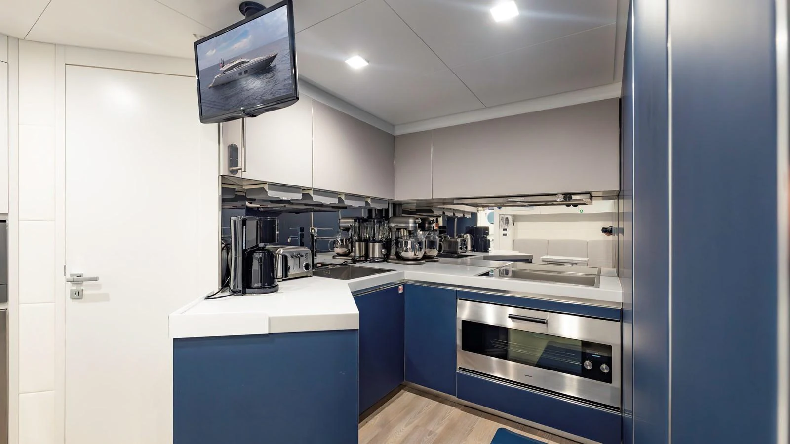 The yacht's galley is equipped with modern appliances and sleek cabinetry, offering a functional and stylish space for meal preparation. aboard ANDIAMO II Yacht for Sale