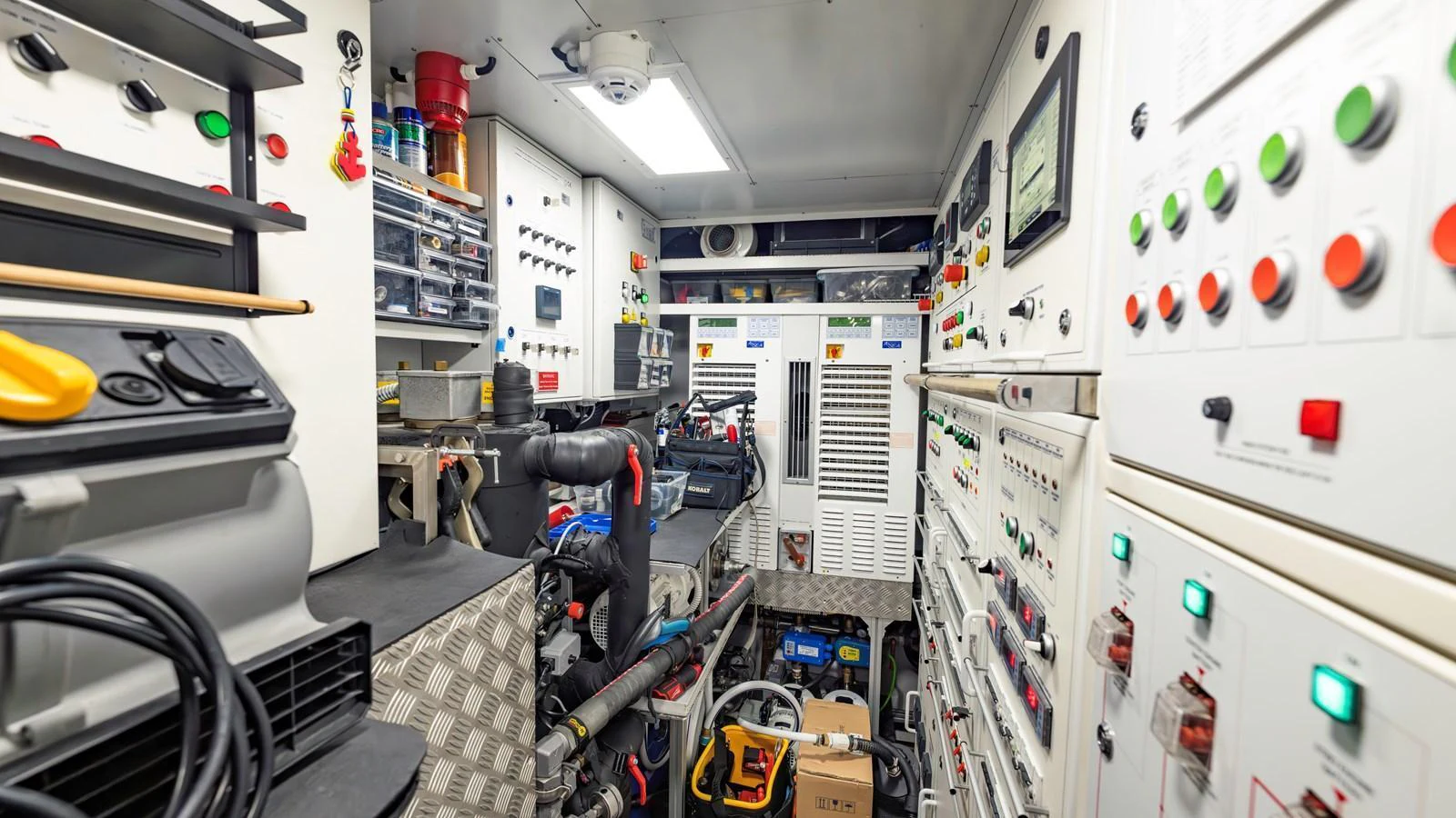 The image showcases the yacht's well-organized engine room with various controls and equipment. aboard ANDIAMO II Yacht for Sale