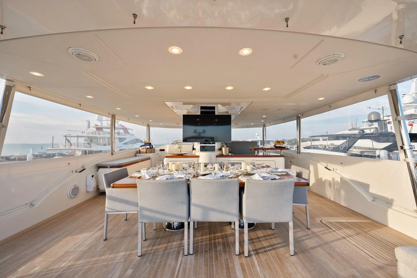 a room with tables and chairs aboard FONTANA Yacht for Sale