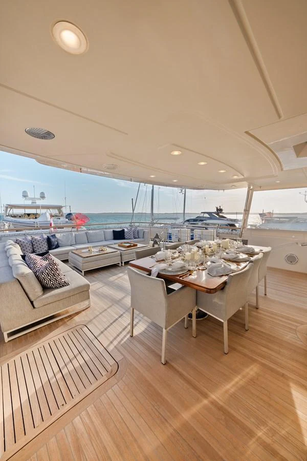 a room with a table and chairs aboard FONTANA Yacht for Sale