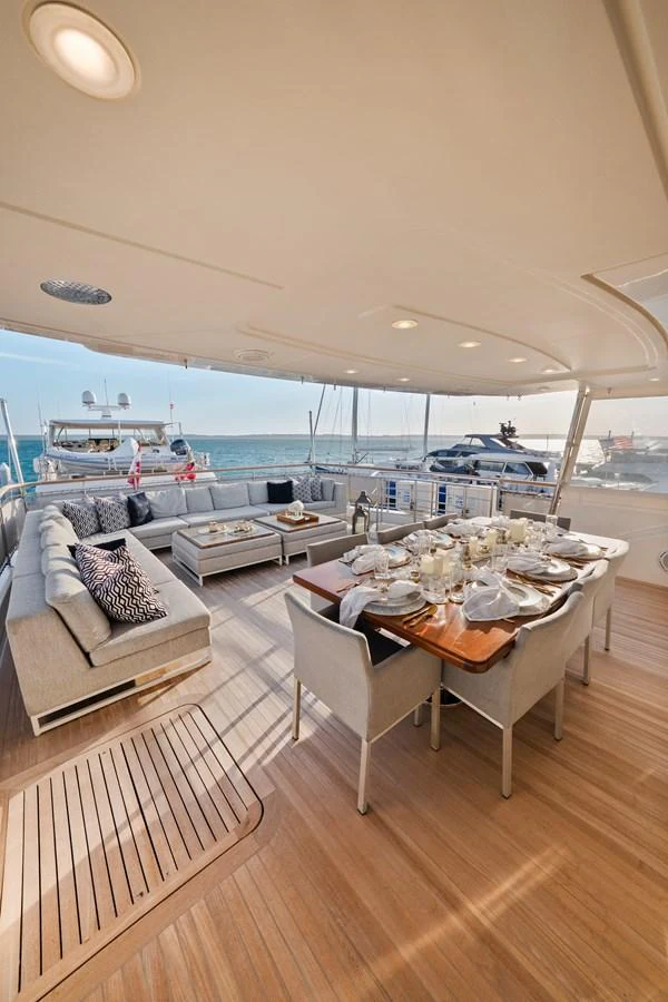 a room with a table and chairs aboard FONTANA Yacht for Sale