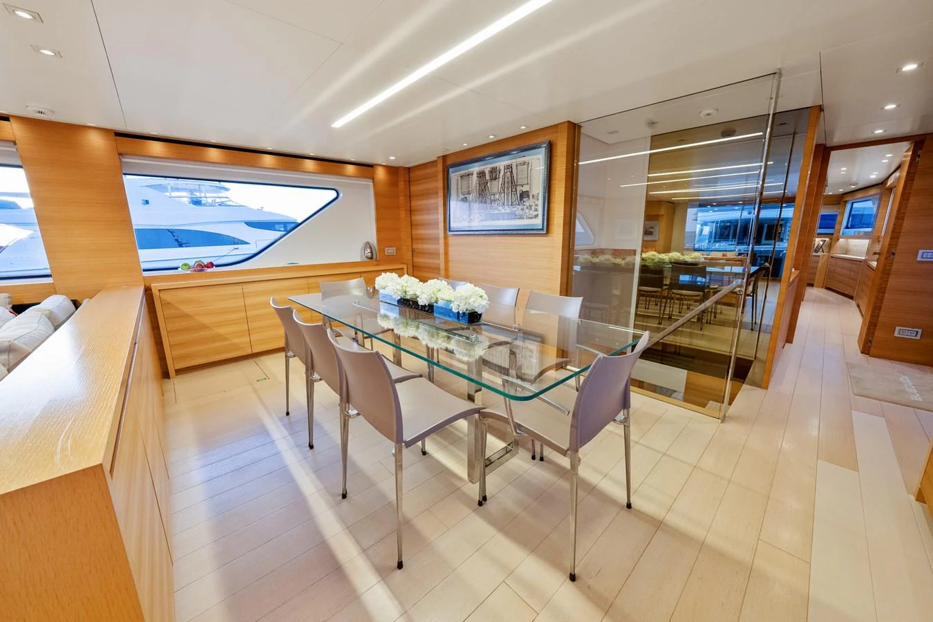 a room with a table and chairs aboard FONTANA Yacht for Sale