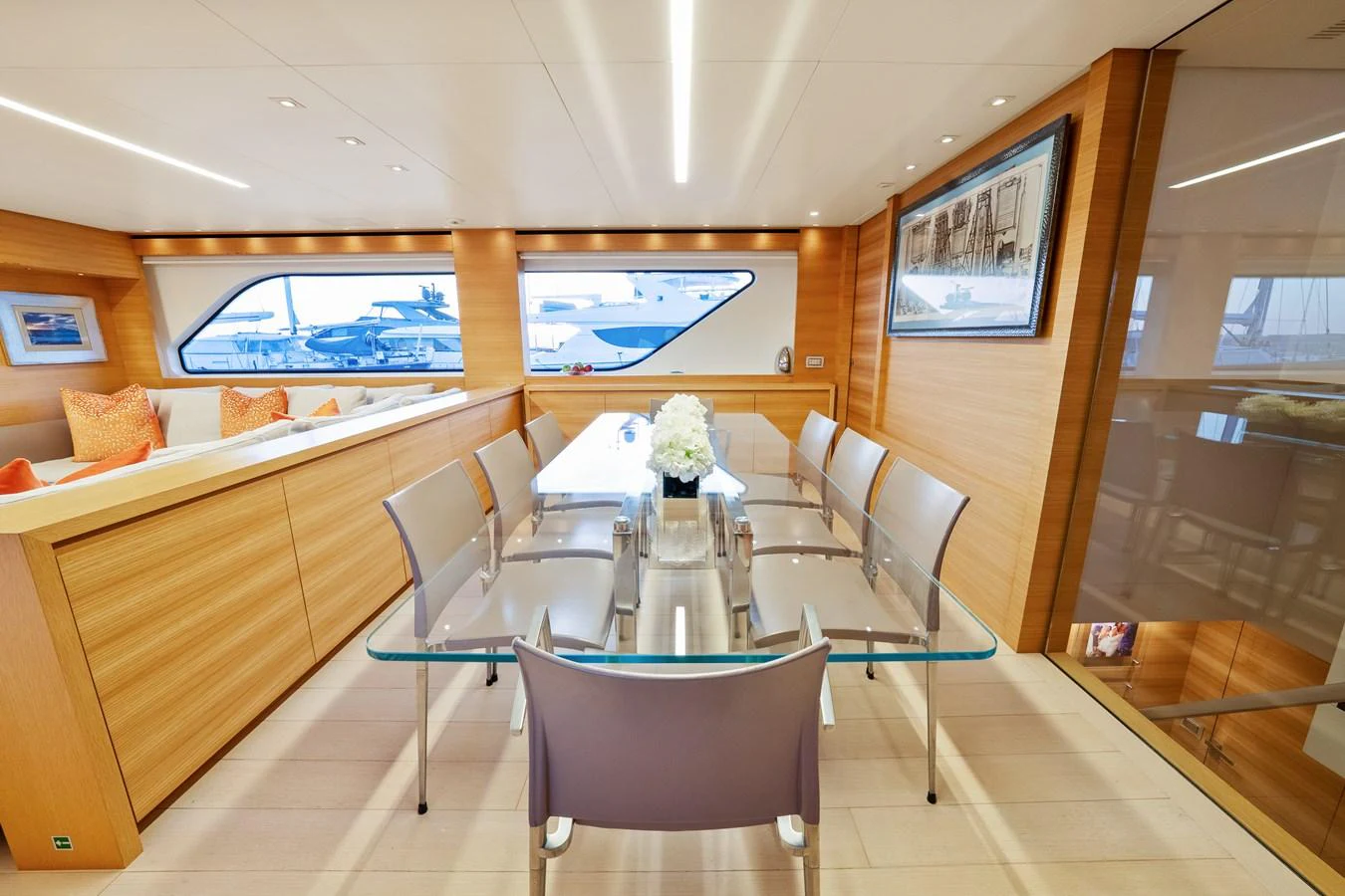 a room with a table and chairs aboard FONTANA Yacht for Sale
