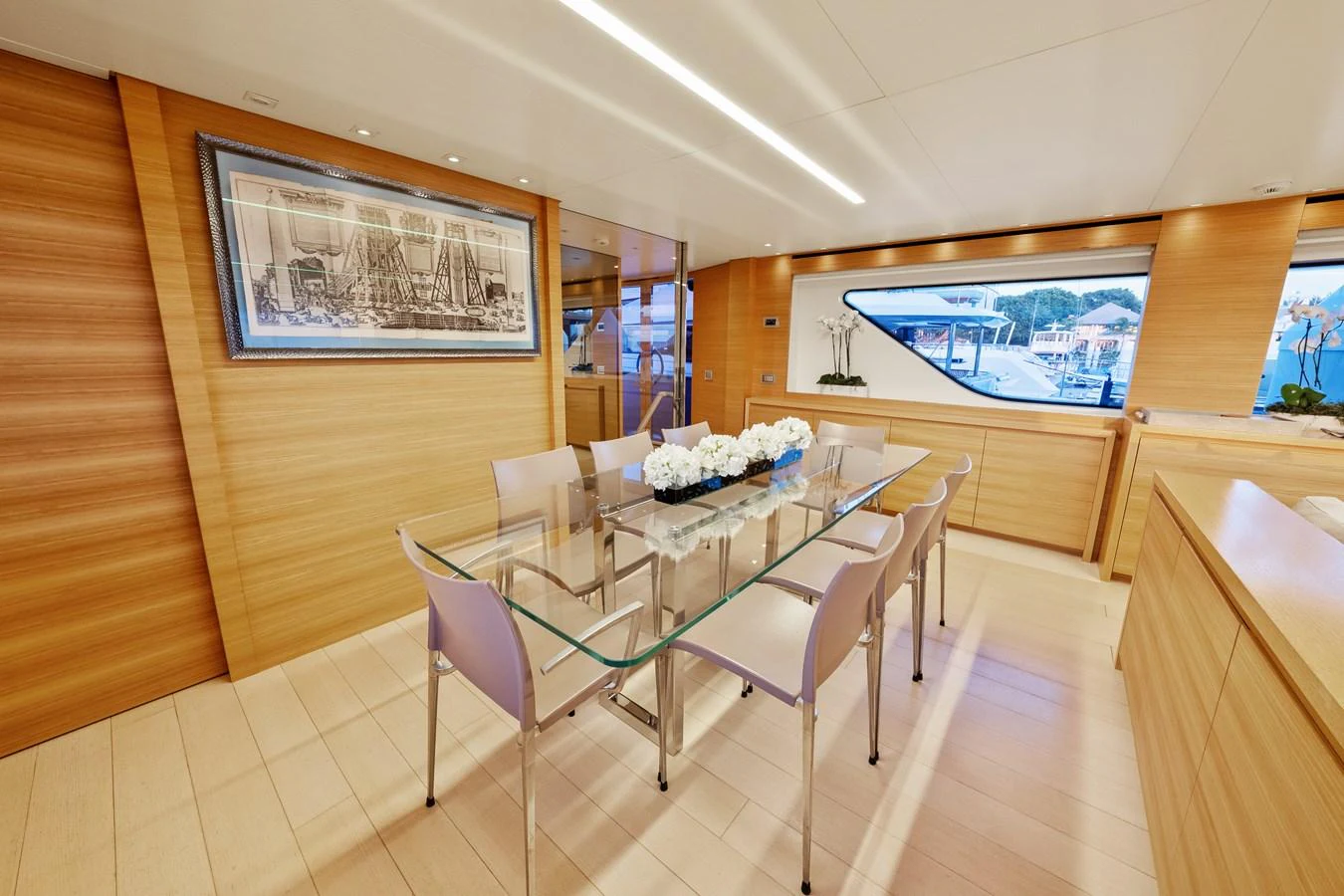 a dining table in a room aboard FONTANA Yacht for Sale