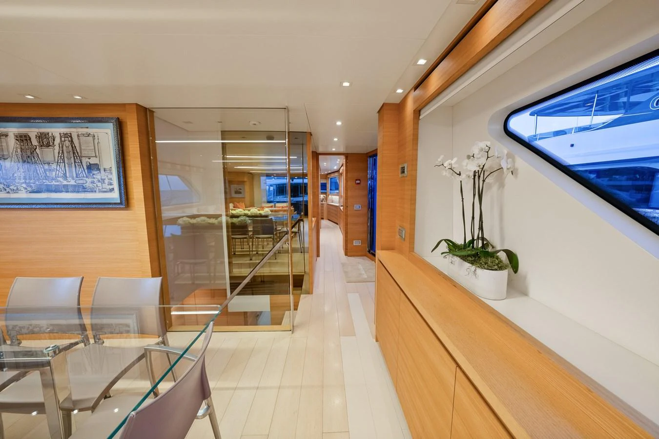 a room with a glass door and a table and chairs aboard FONTANA Yacht for Sale