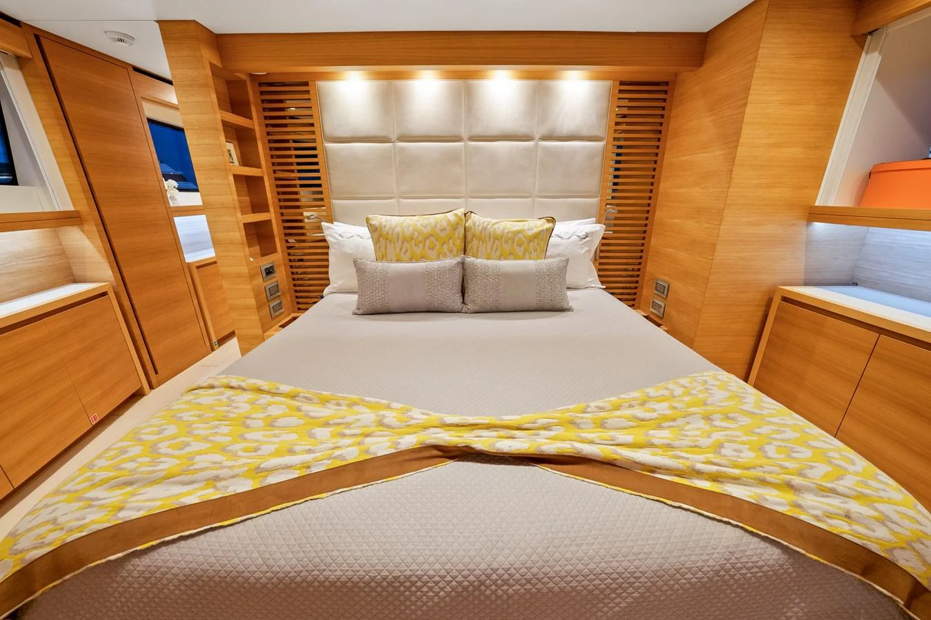 a bed with a white sheet and pillows on it aboard FONTANA Yacht for Sale