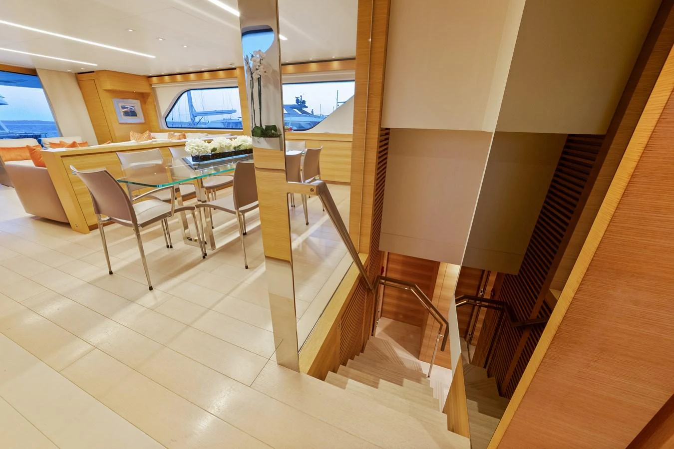 a room with tables and chairs aboard FONTANA Yacht for Sale