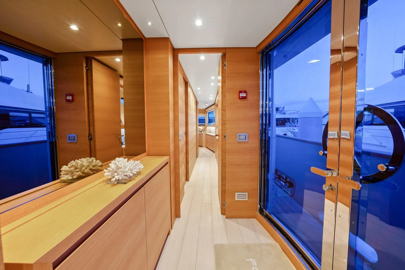 a hallway with glass doors aboard FONTANA Yacht for Sale