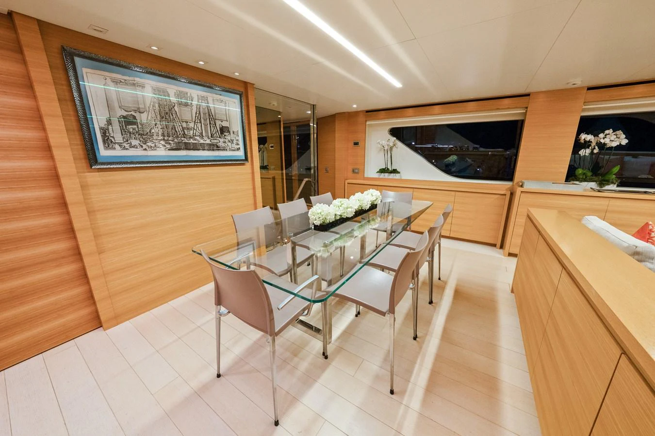 a kitchen with a table and chairs aboard FONTANA Yacht for Sale