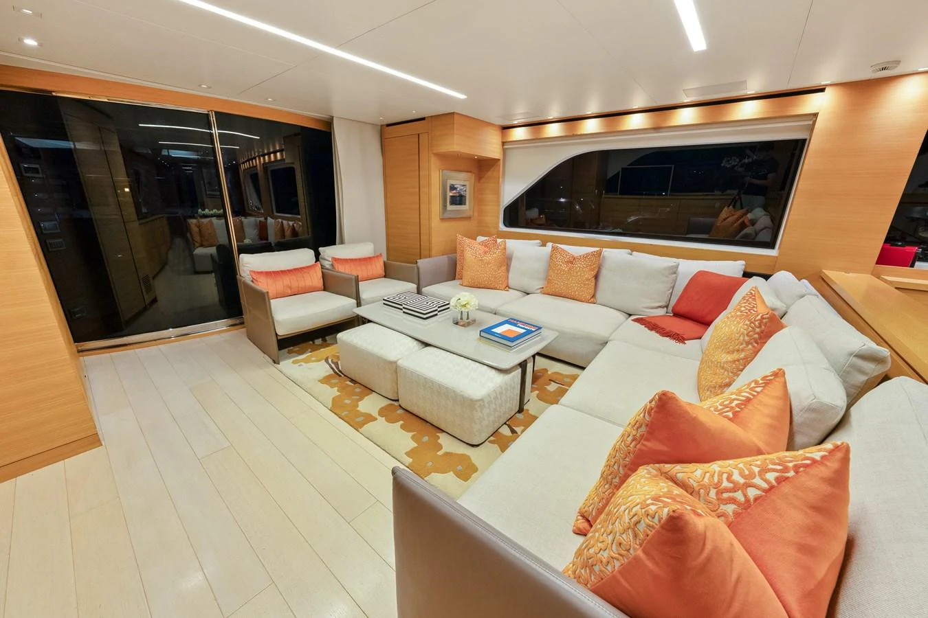 a living room with a large mirror aboard FONTANA Yacht for Sale