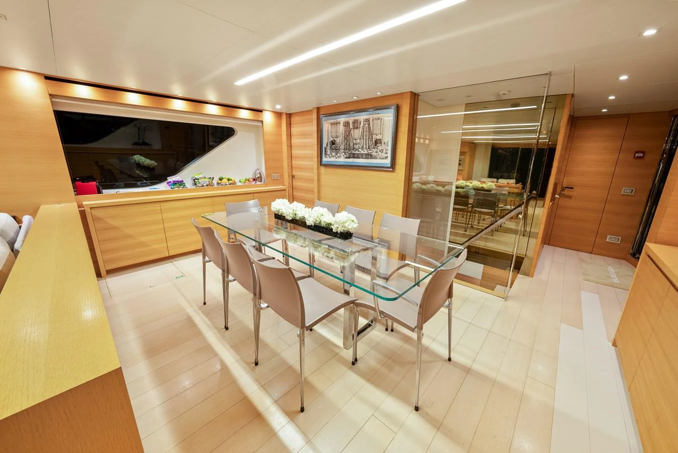 a dining room with a table aboard FONTANA Yacht for Sale