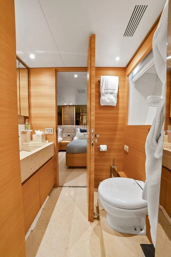 a bathroom with a toilet and a sink aboard FONTANA Yacht for Sale