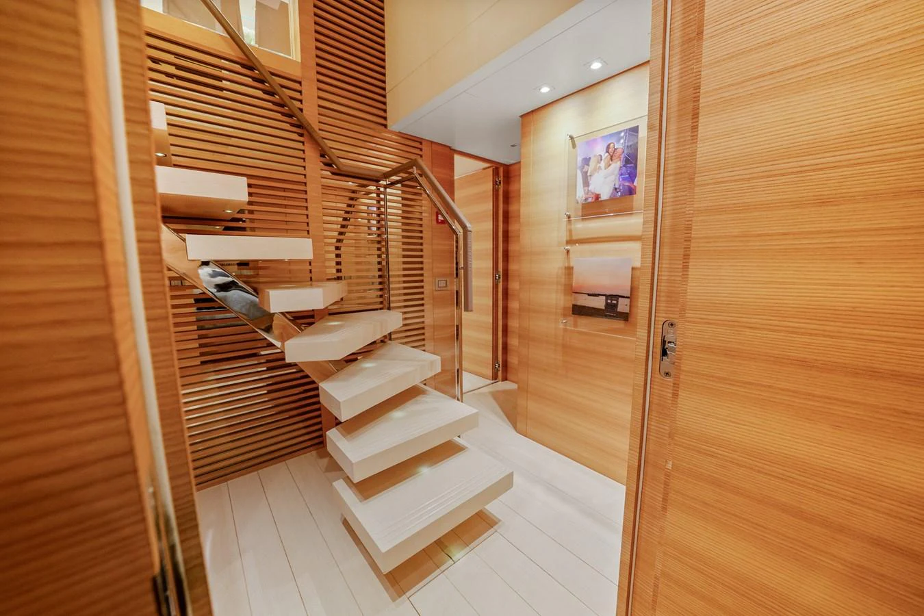 a long hallway with wooden doors aboard FONTANA Yacht for Sale