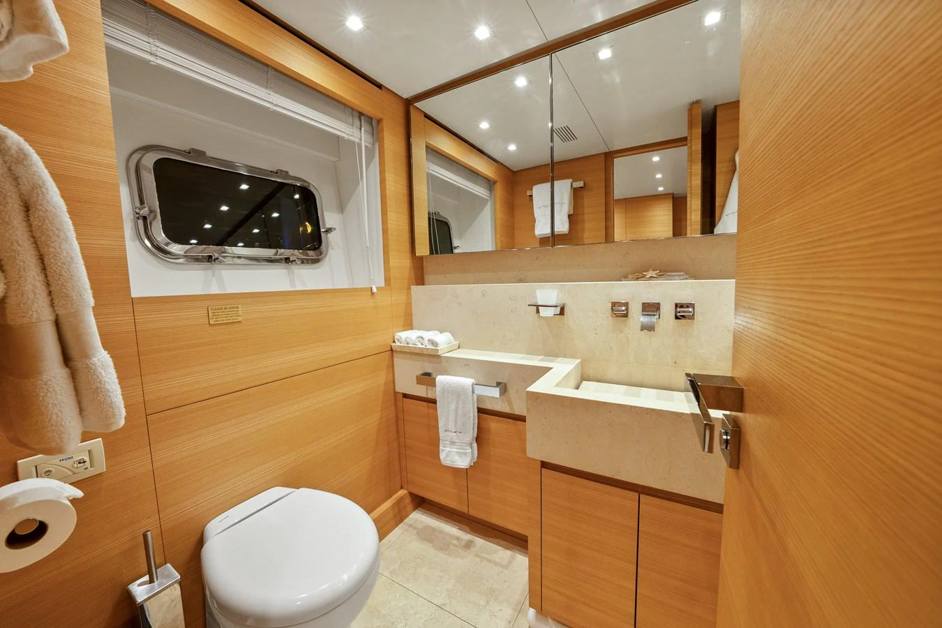 a bathroom with a large mirror aboard FONTANA Yacht for Sale