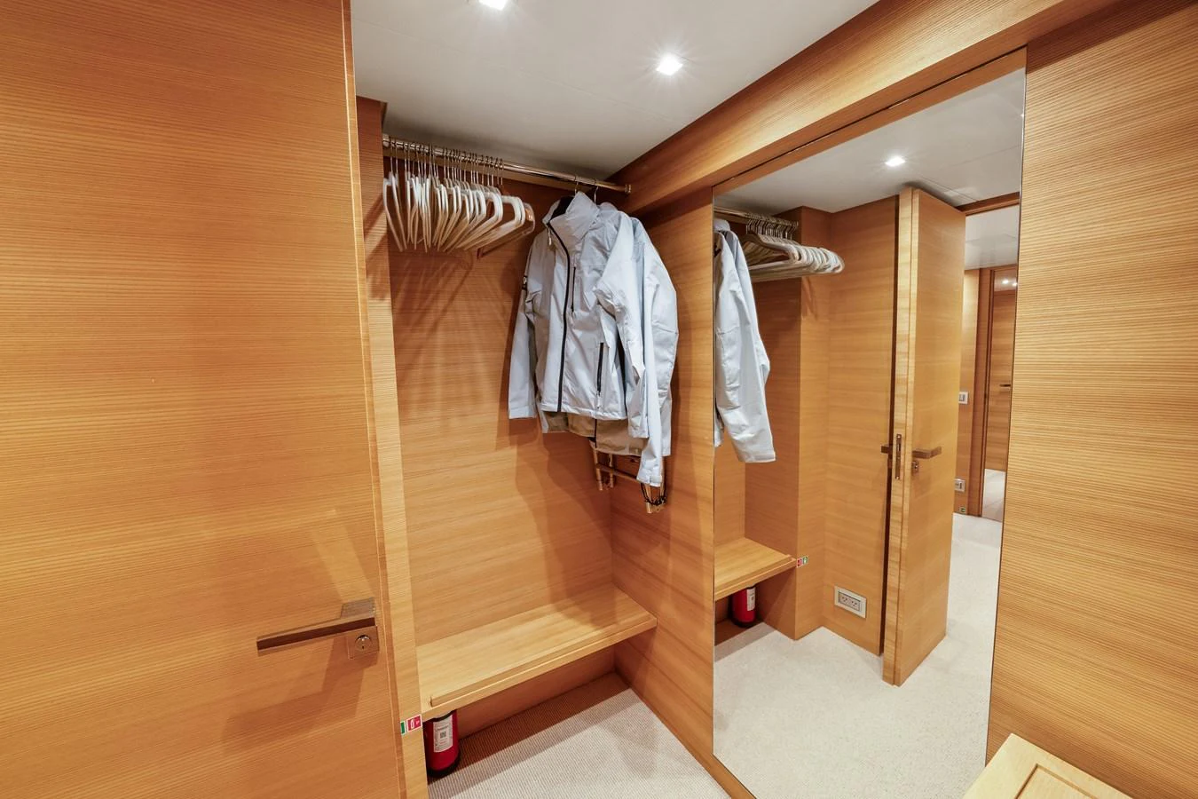a closet with clothes on the wall aboard FONTANA Yacht for Sale