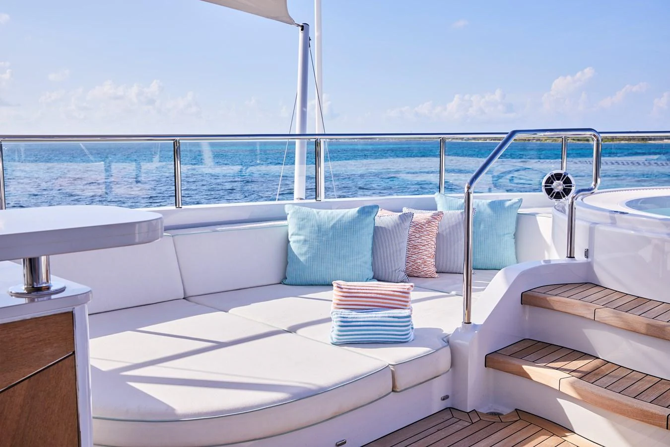 The sundeck offers a luxurious lounging area with plush cushions and a stunning ocean view. aboard ARKADIA Yacht for Sale