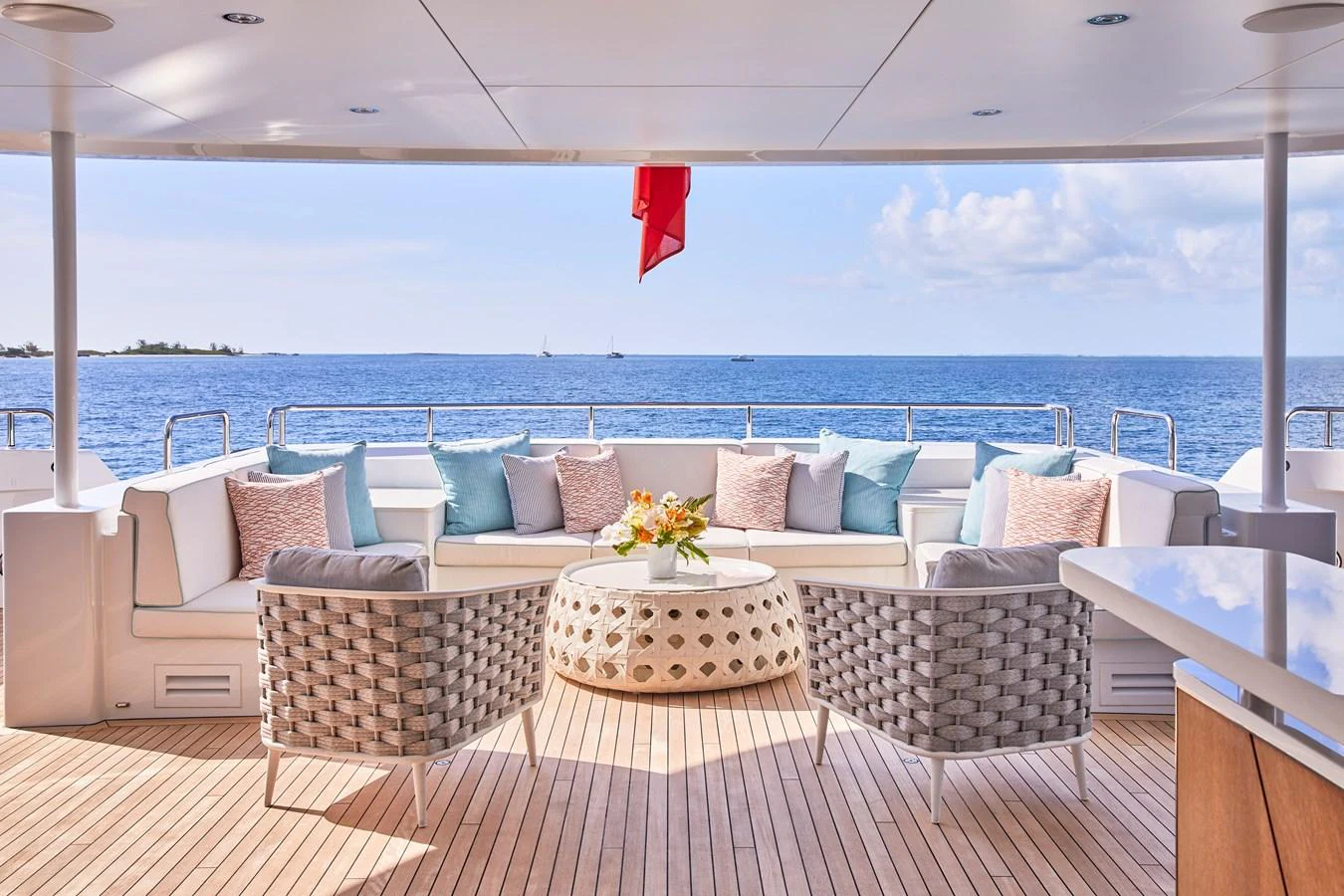 The aft deck features a spacious seating area with a stunning ocean view. aboard ARKADIA Yacht for Sale