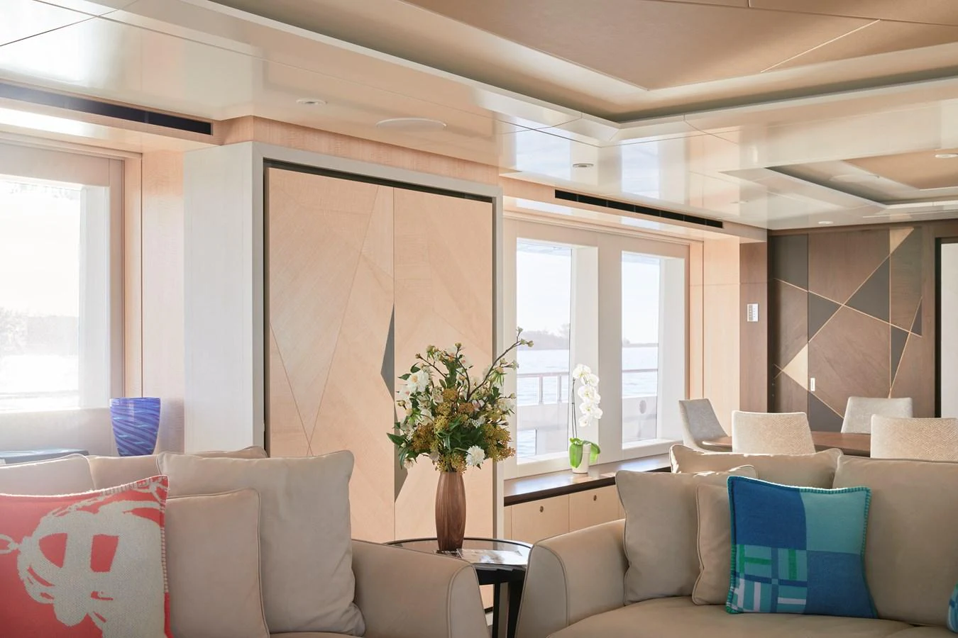 The yacht's interior features a stylish and comfortable seating area with large windows providing ample natural light. aboard ARKADIA Yacht for Sale