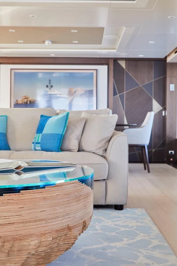 The yacht's interior features a stylish and comfortable seating area with modern decor. aboard ARKADIA Yacht for Sale
