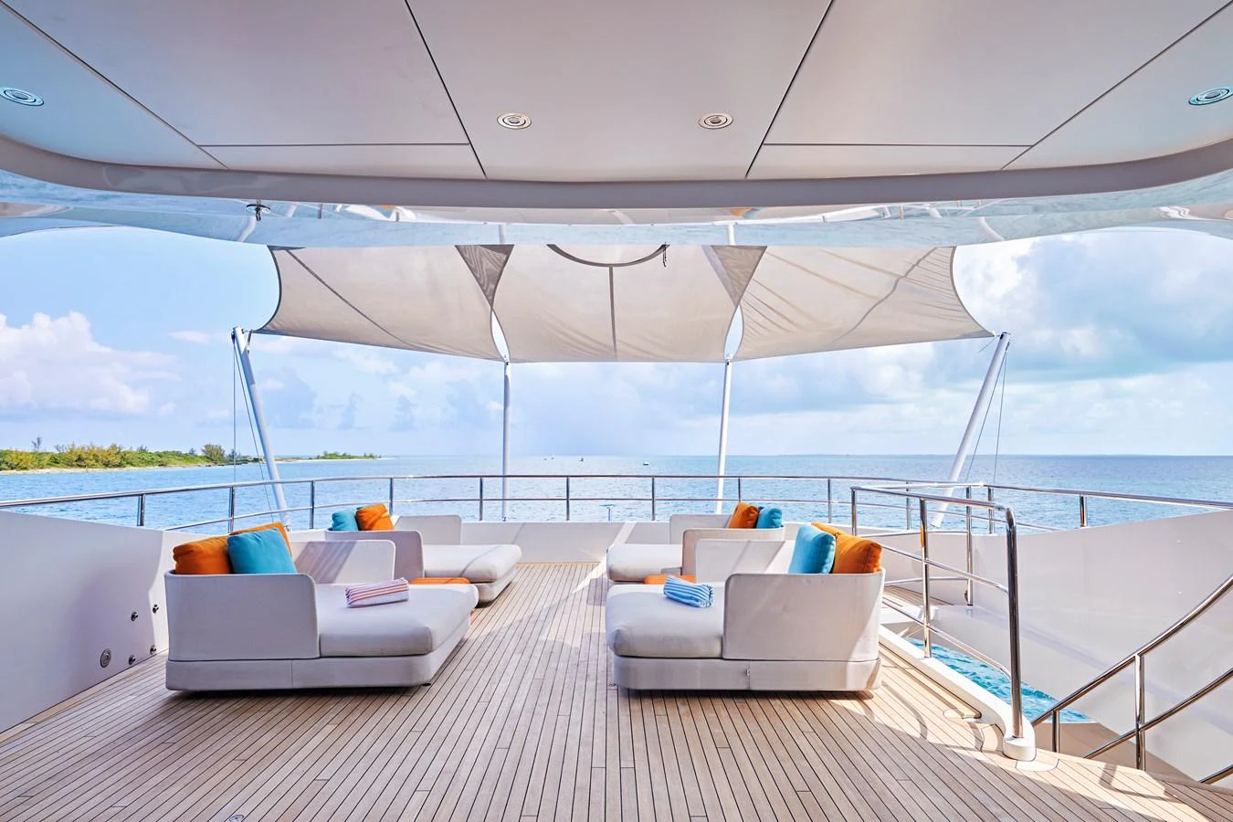 The sundeck offers a luxurious and spacious lounging area with comfortable seating and stunning ocean views. aboard ARKADIA Yacht for Sale