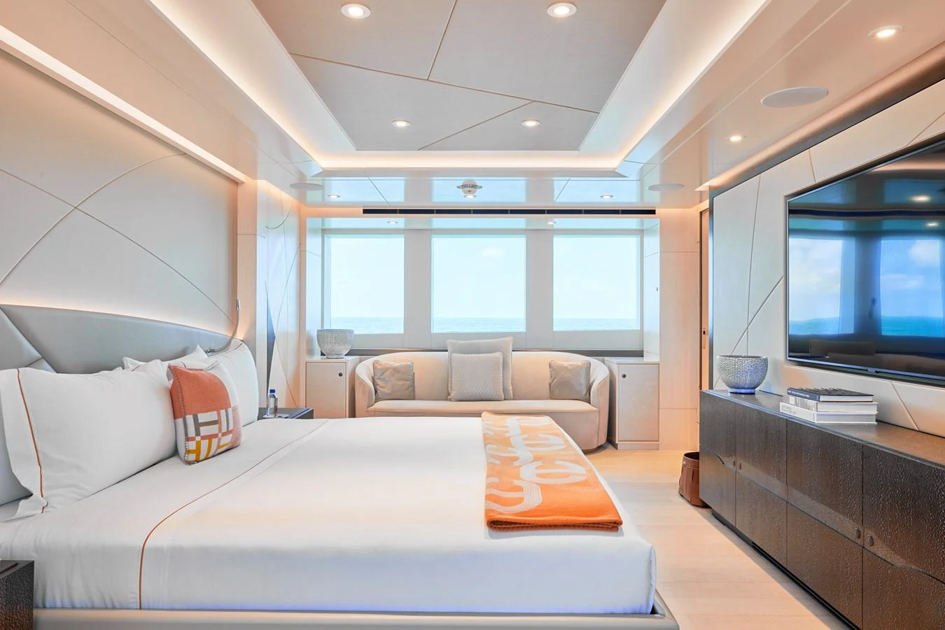 The master stateroom features a luxurious bed, ample natural light, and modern decor. aboard ARKADIA Yacht for Sale
