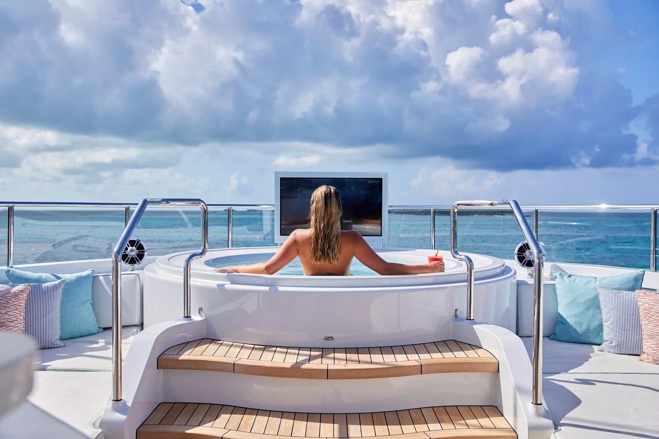 A luxurious sundeck with a jacuzzi and stunning ocean views. aboard ARKADIA Yacht for Sale