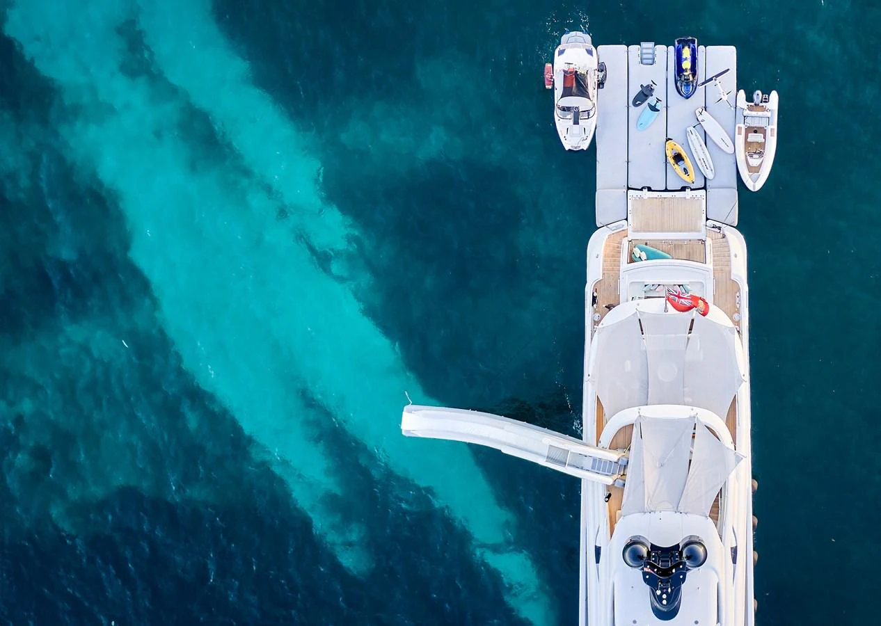 The yacht's aft deck is equipped with a slide and various water toys, perfect for aquatic adventures. aboard ARKADIA Yacht for Sale