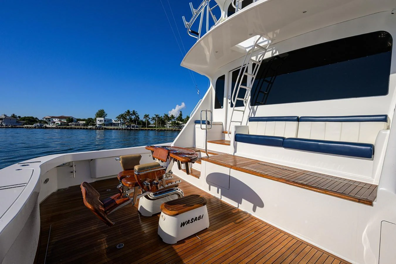 The aft deck features comfortable seating and a well-equipped fishing area, perfect for leisure and sport. aboard WASABI Yacht for Sale