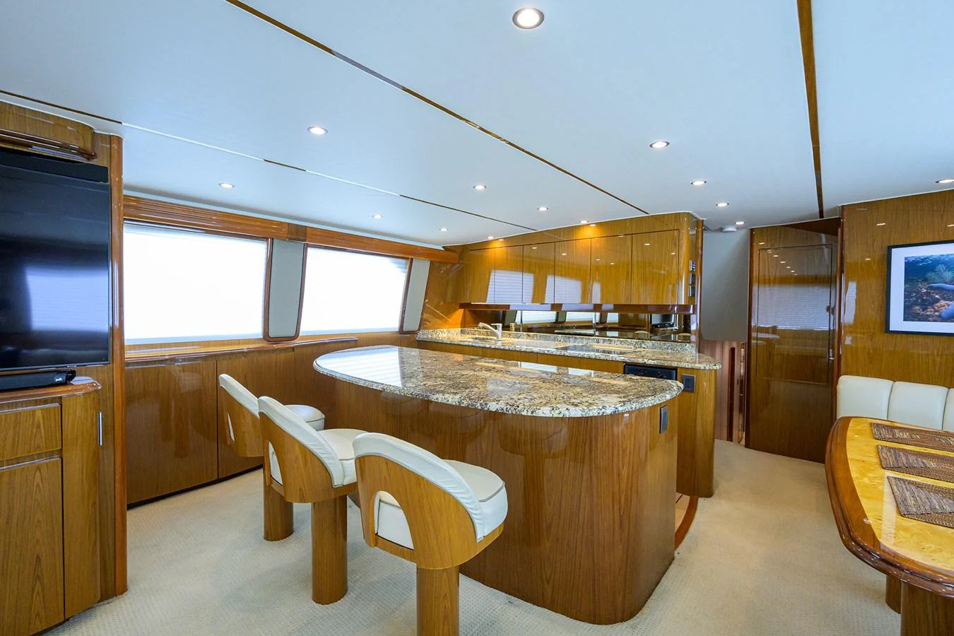 The yacht's galley features a sleek, modern design with ample counter space and comfortable seating. aboard WASABI Yacht for Sale