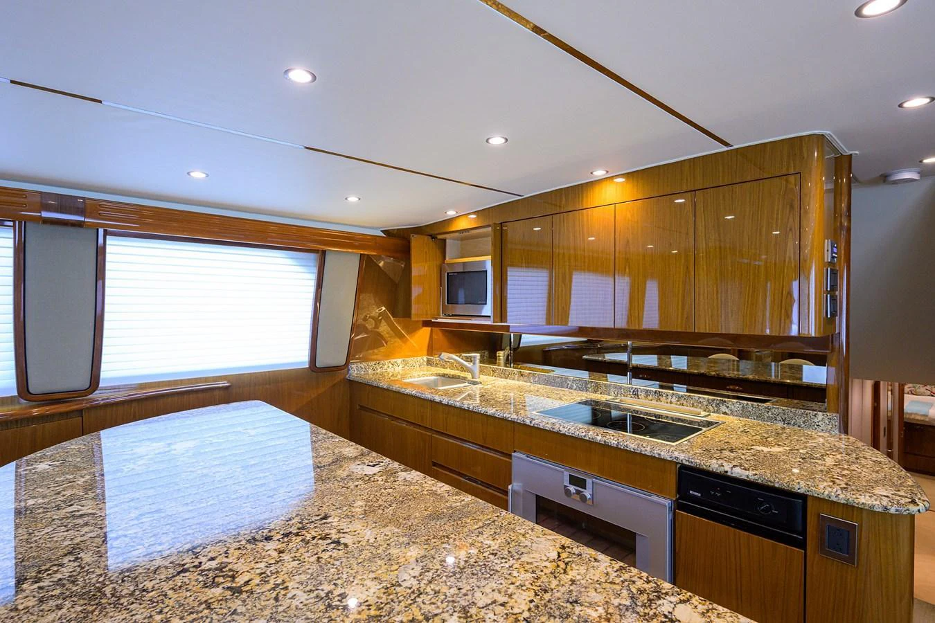 The yacht's galley features luxurious granite countertops and modern appliances. aboard WASABI Yacht for Sale