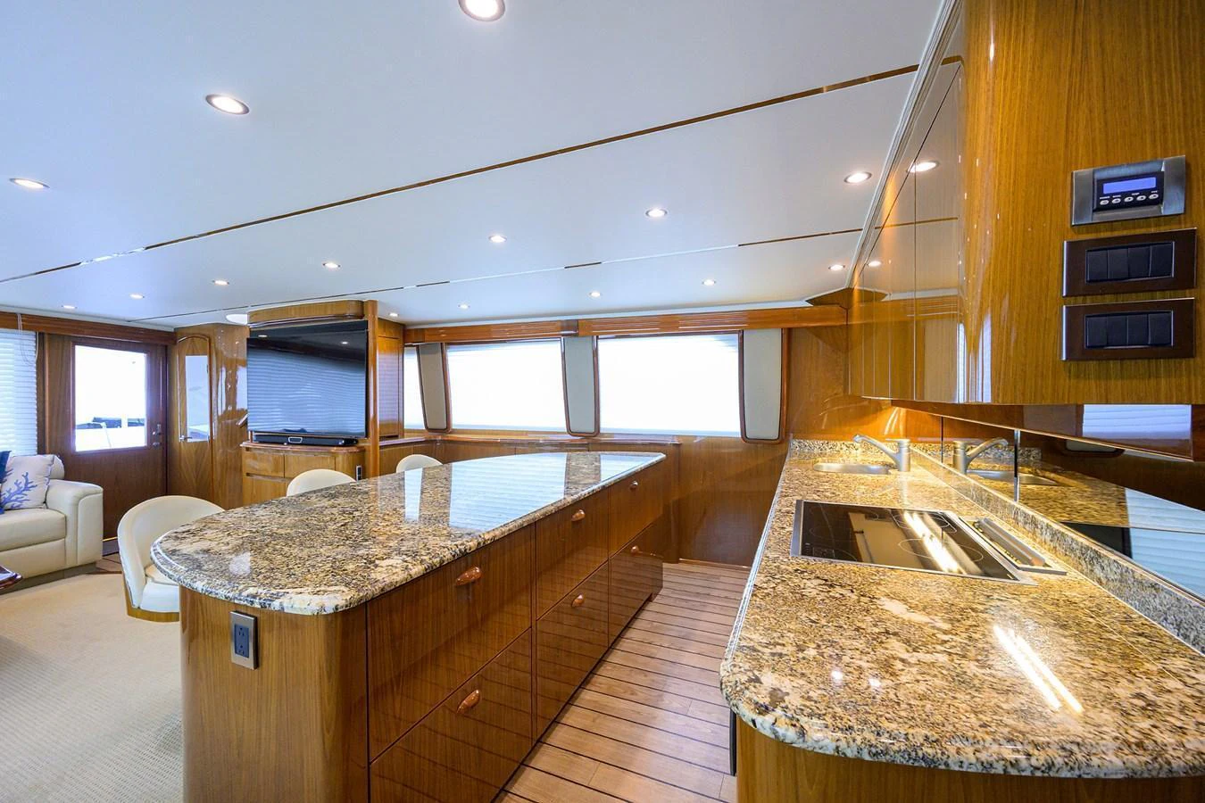 The yacht's galley features luxurious granite countertops and modern appliances, creating a sophisticated and functional space. aboard WASABI Yacht for Sale