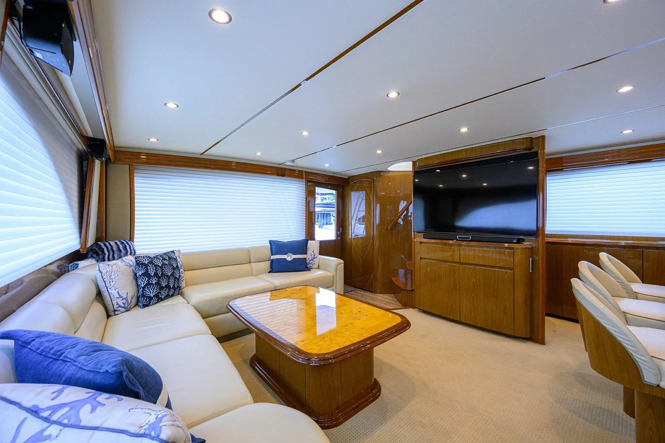 The spacious salon features comfortable seating and a large entertainment center. aboard WASABI Yacht for Sale