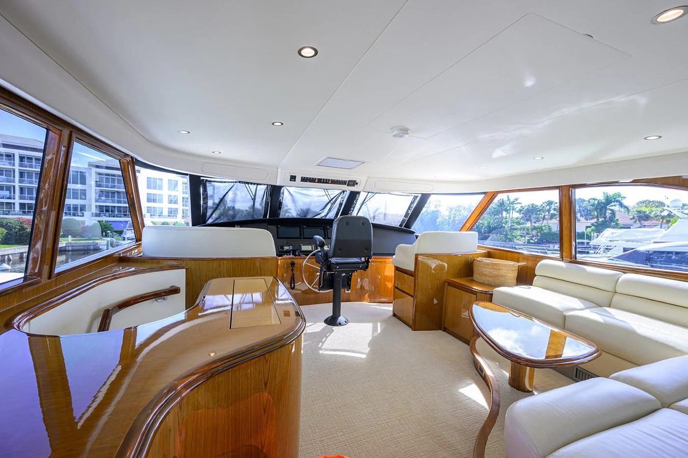 The yacht's helm area features luxurious seating and expansive windows offering panoramic views. aboard WASABI Yacht for Sale