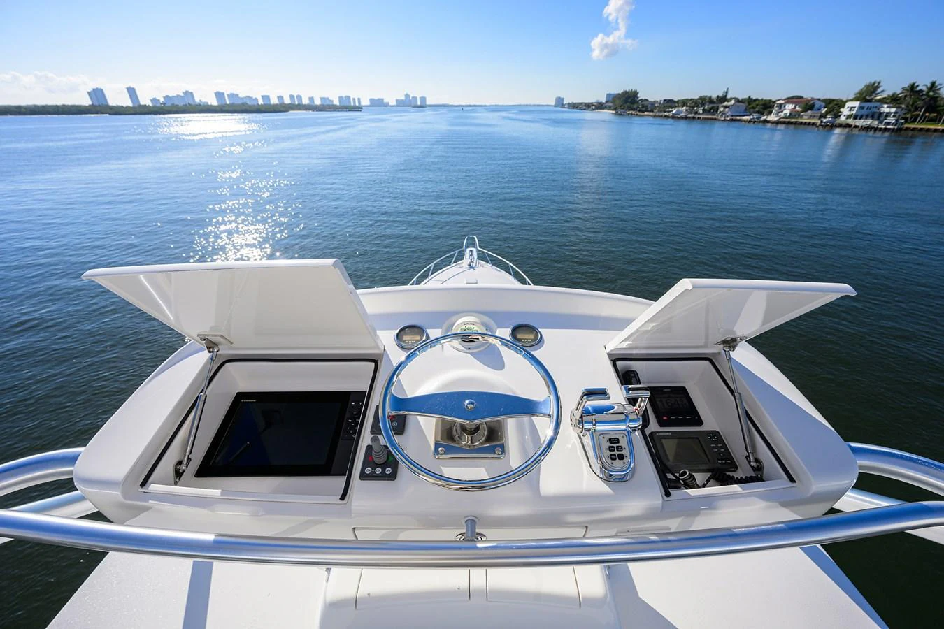 The helm station offers a commanding view of the serene waters ahead. aboard WASABI Yacht for Sale