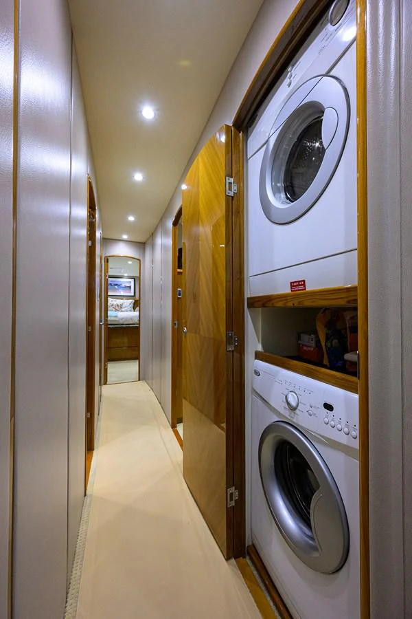 The yacht features a well-equipped laundry area with modern appliances. aboard WASABI Yacht for Sale