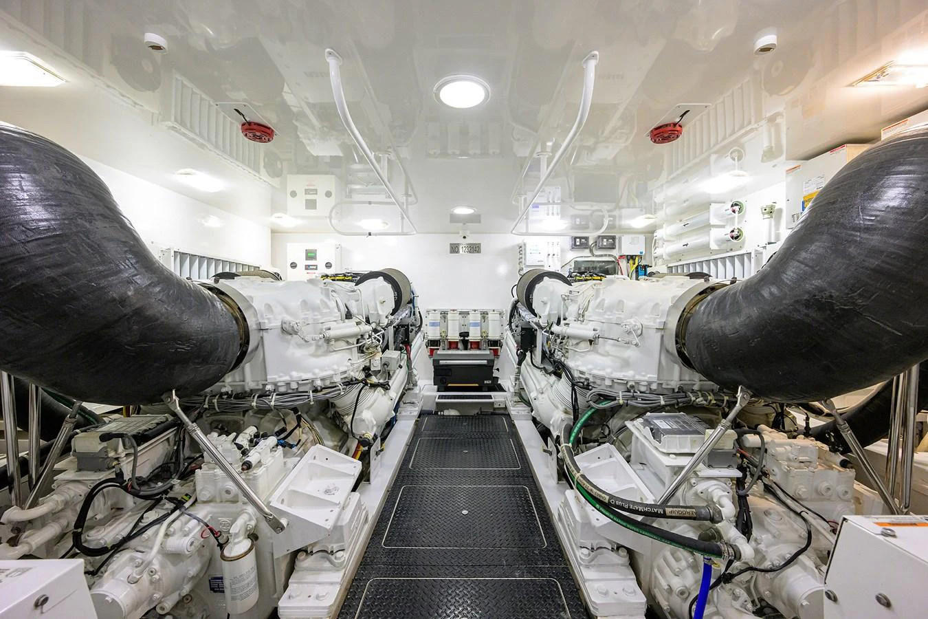 The engine room showcases powerful twin engines and a meticulously organized layout. aboard WASABI Yacht for Sale
