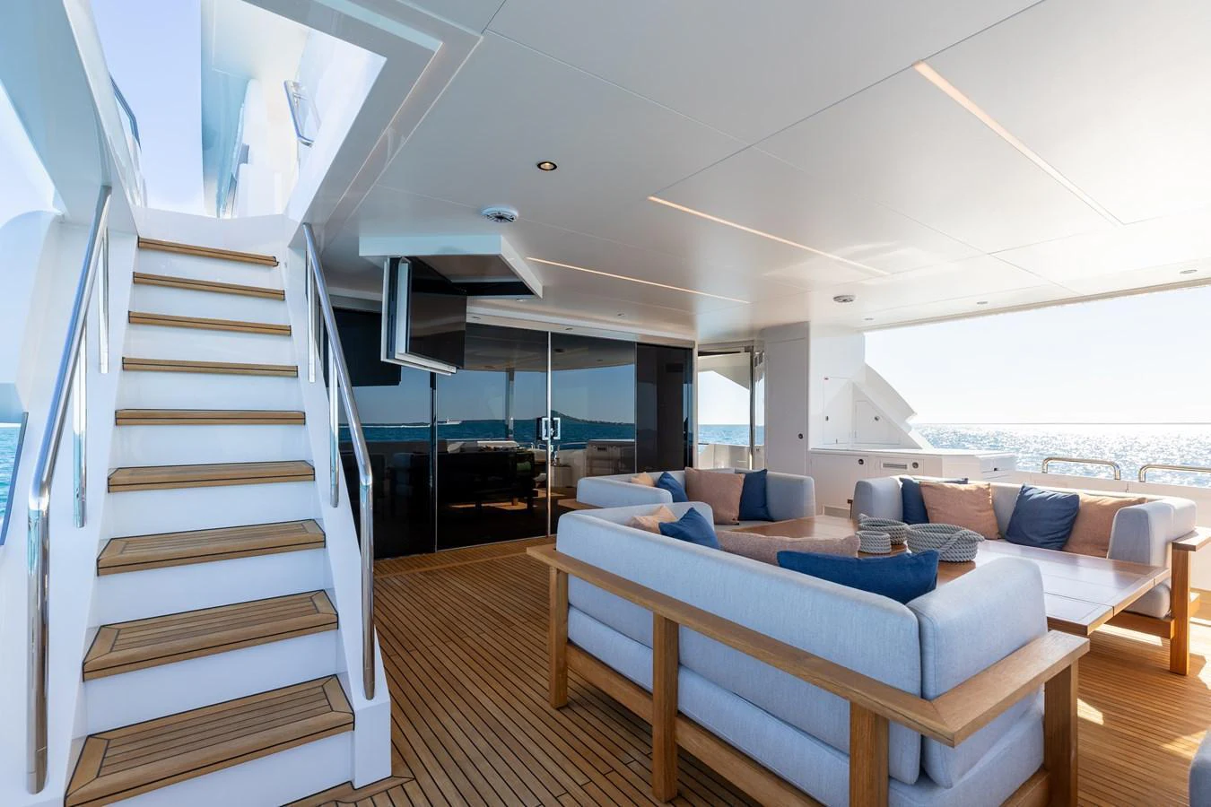 The aft deck features comfortable seating with a view of the ocean, perfect for relaxation. aboard NEX-T Yacht for Sale