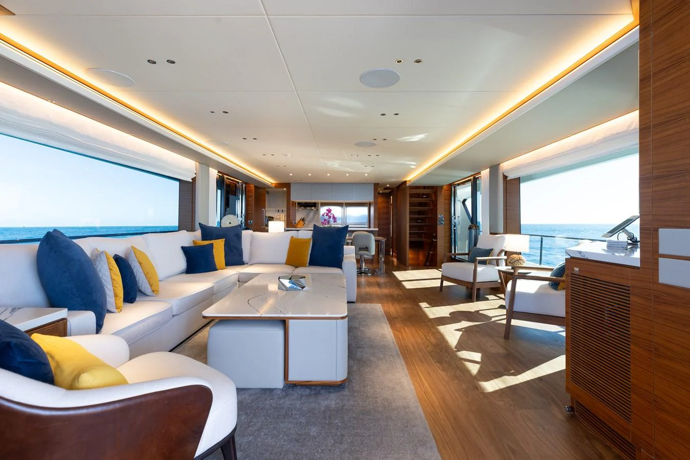 The salon features a spacious and elegantly designed seating area with panoramic views. aboard NEX-T Yacht for Sale