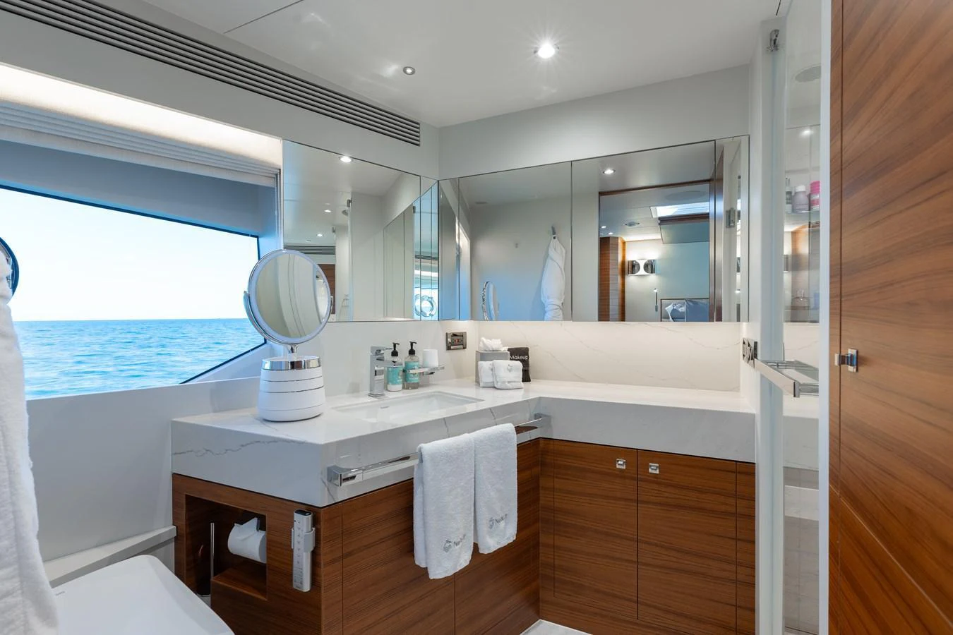The yacht's bathroom features modern fixtures and a serene ocean view through the window. aboard NEX-T Yacht for Sale