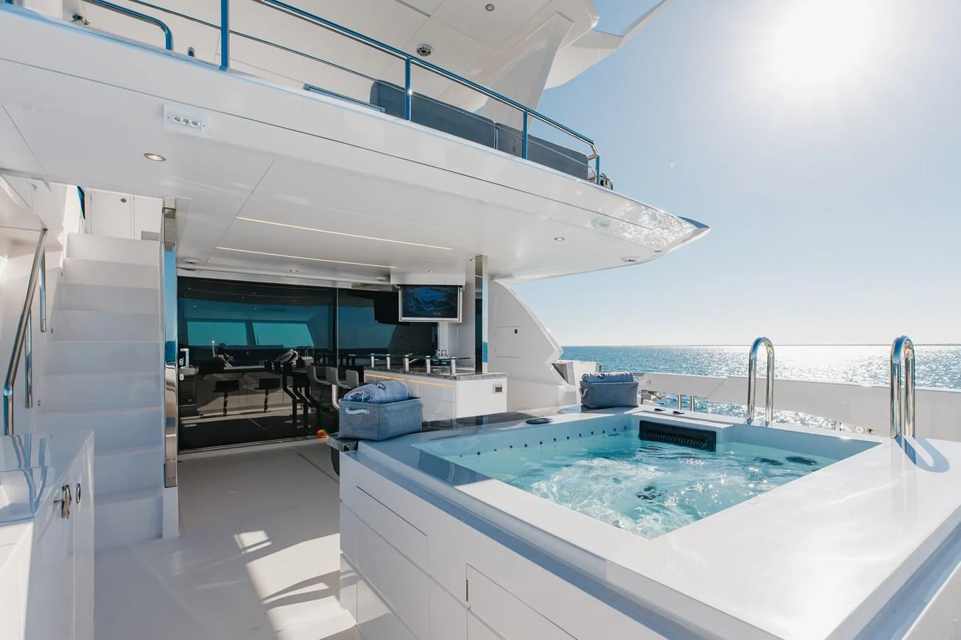 The sundeck features a luxurious hot tub with stunning ocean views. aboard NEX-T Yacht for Sale