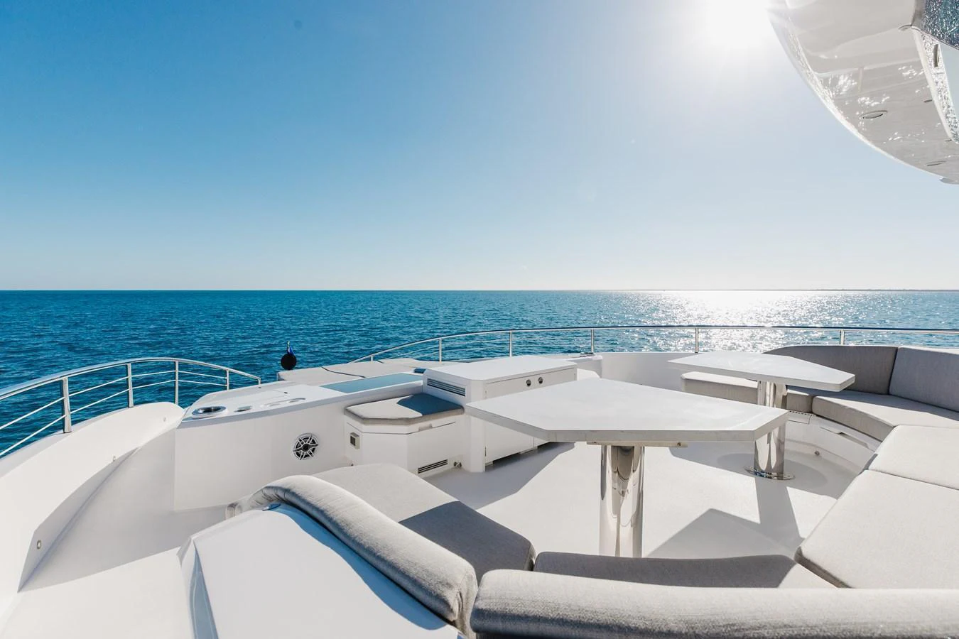 The flybridge offers a spacious and comfortable seating area with stunning ocean views. aboard NEX-T Yacht for Sale