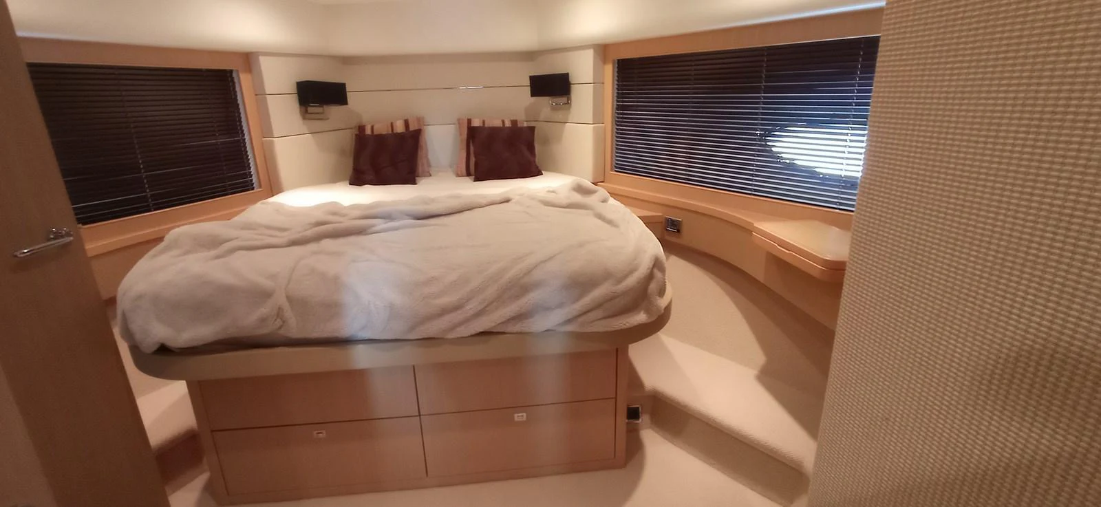 A cozy stateroom with a large bed and modern furnishings. aboard SFYFALL Yacht for Sale