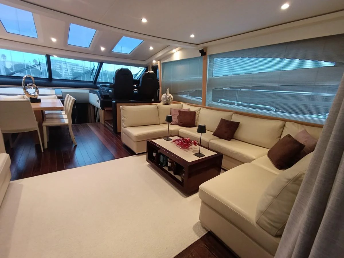 The salon features a spacious seating area with a modern and elegant design. aboard SFYFALL Yacht for Sale