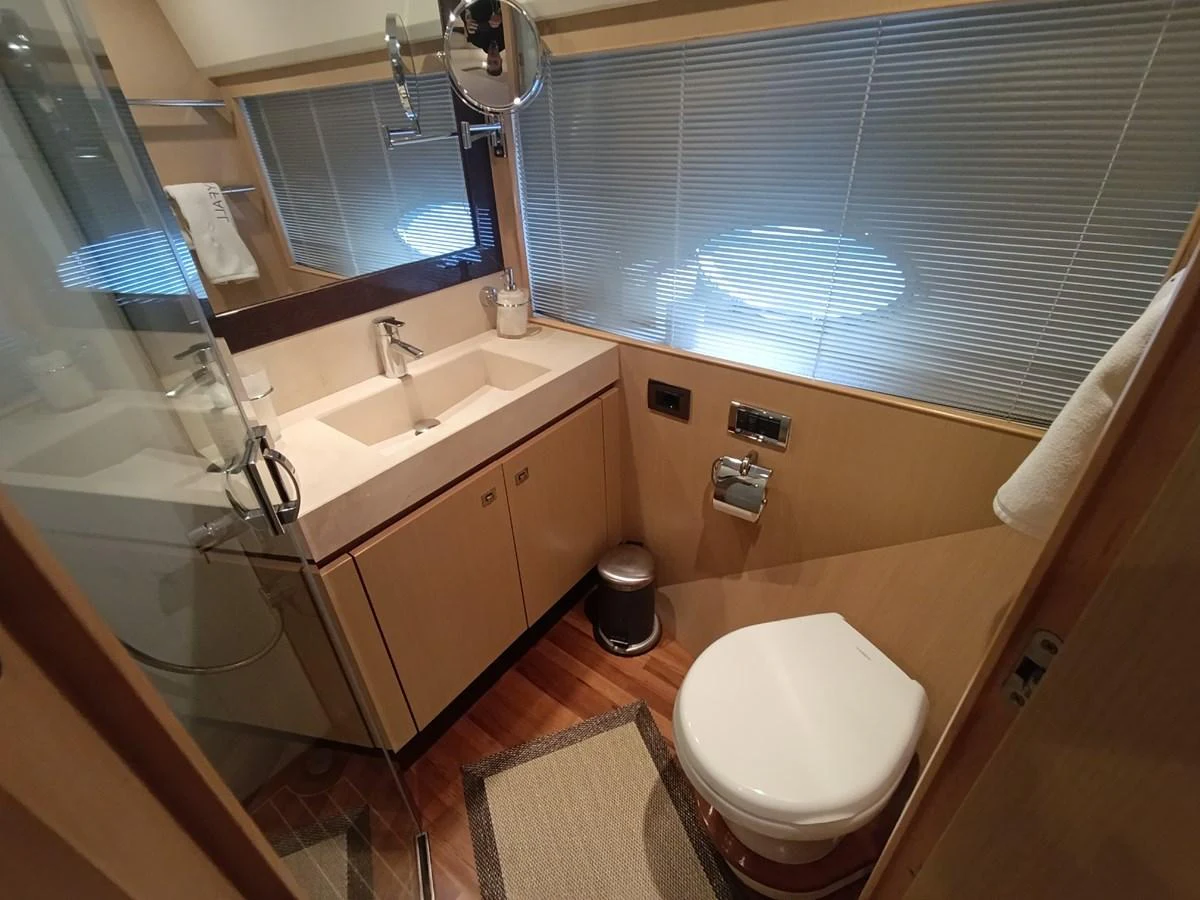 A well-appointed yacht bathroom featuring modern fixtures and a clean design. aboard SFYFALL Yacht for Sale