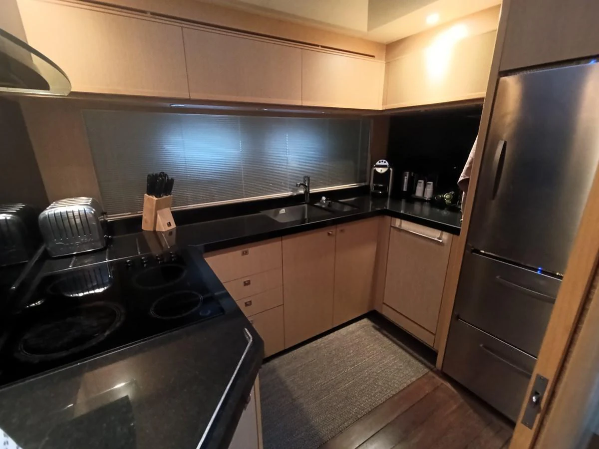 The yacht's galley features modern appliances and sleek countertops, providing a functional and stylish space for meal preparation. aboard SFYFALL Yacht for Sale
