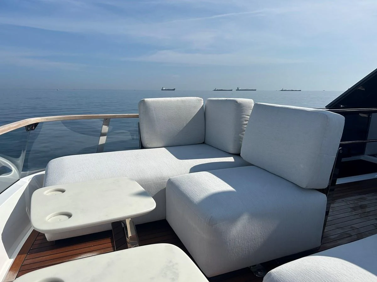 The sundeck offers plush seating with a serene ocean backdrop. aboard FAIRLINE SQUADRON Yacht for Sale
