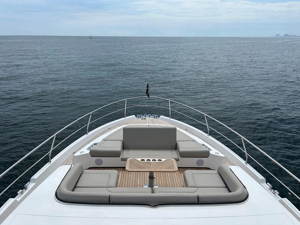 The yacht's foredeck features a spacious seating area with panoramic ocean views. aboard FAIRLINE SQUADRON Yacht for Sale