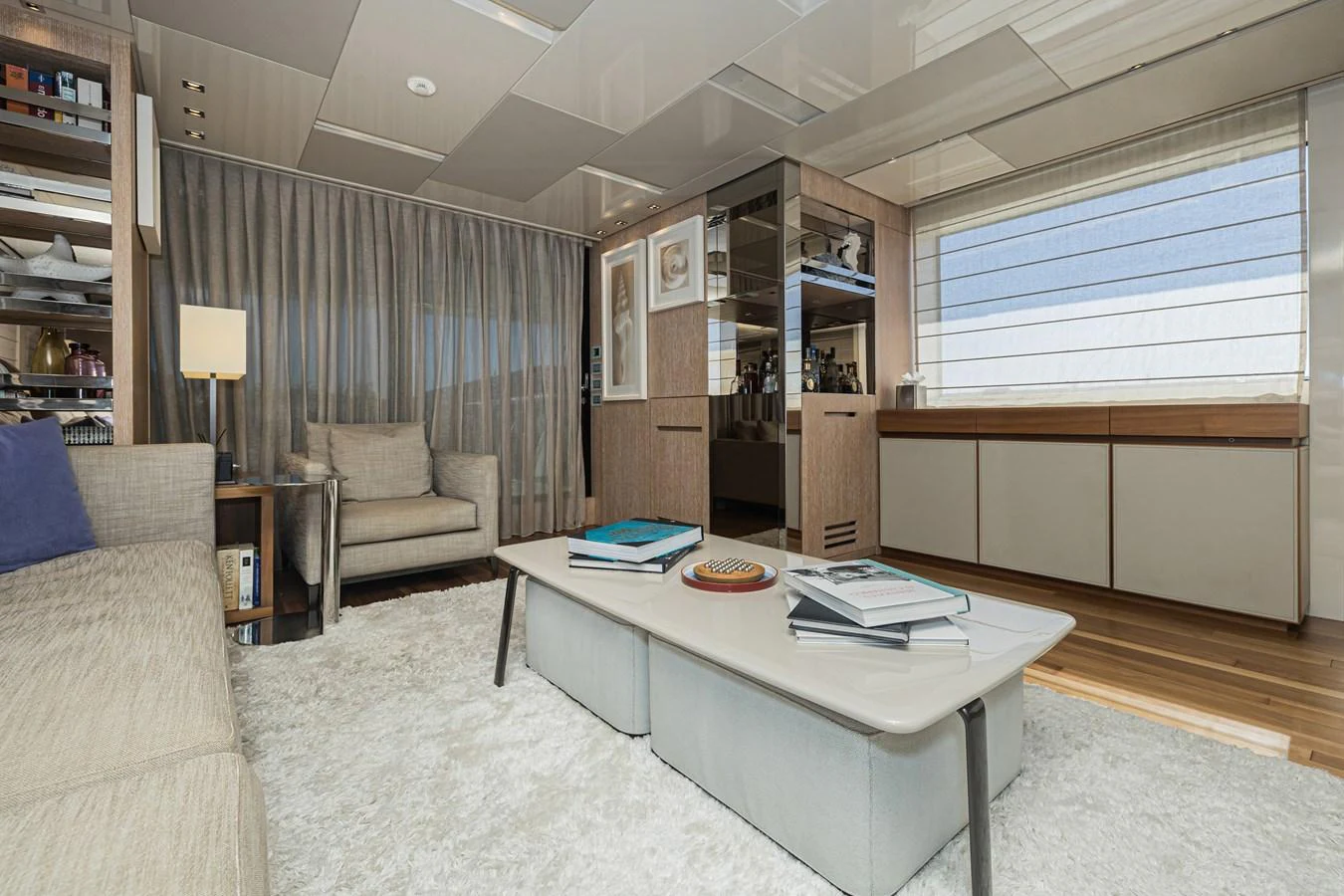 The yacht's salon features a comfortable seating area with modern decor and ample natural light. aboard PERCAL Yacht for Sale