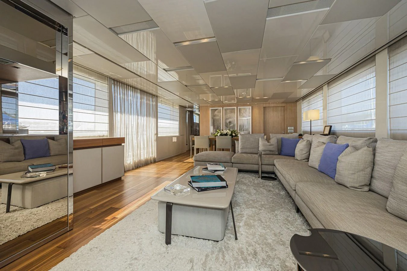 The salon features a spacious and elegantly designed seating area with modern furnishings and ample natural light. aboard PERCAL Yacht for Sale